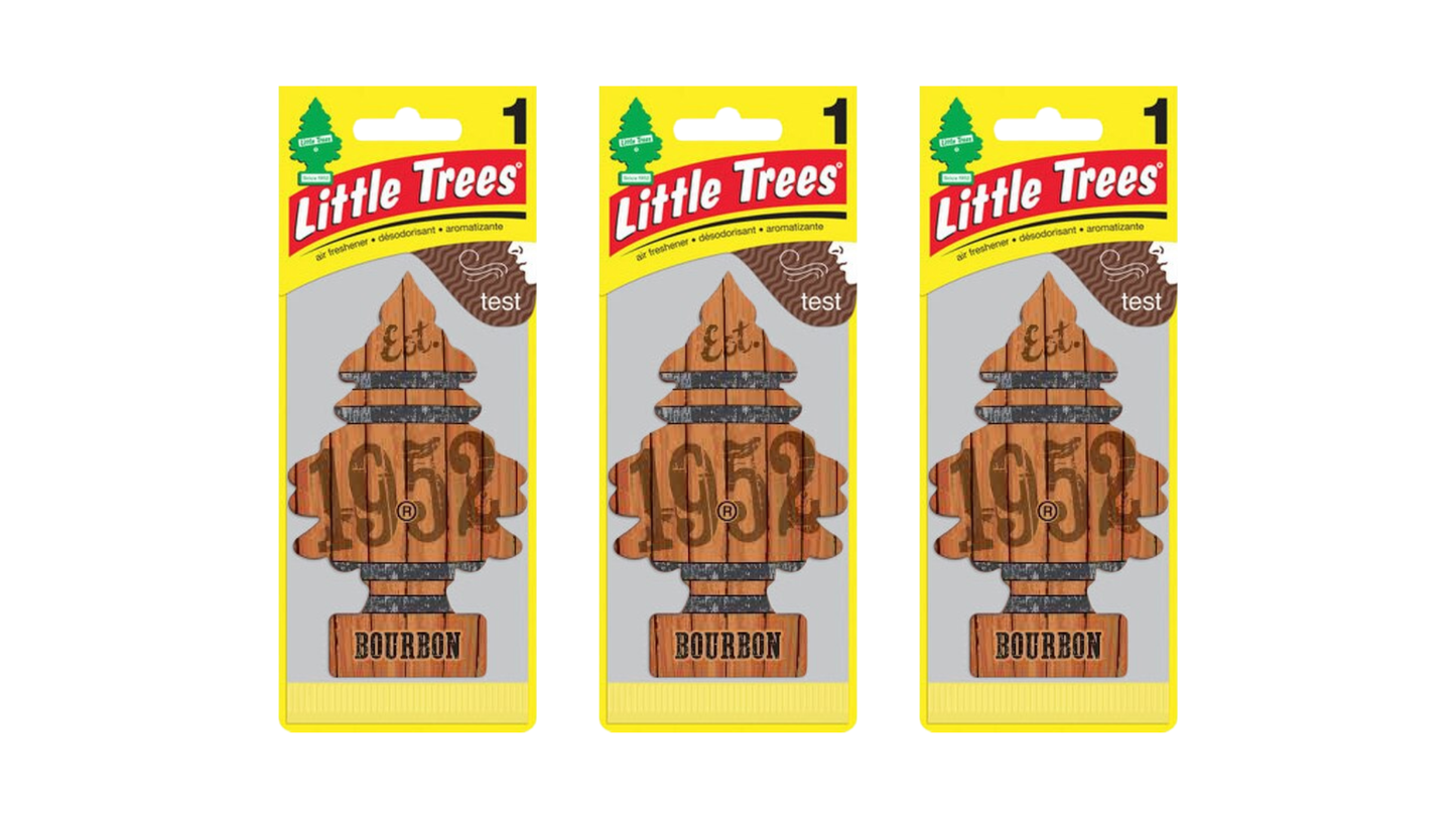 Three packages of Little Trees 1952 Bourbon air fresheners on a white background