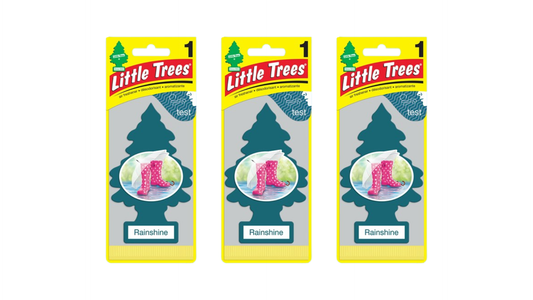 Three packages of Little Trees Rainshine air fresheners on a white background