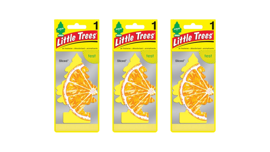 Three packages of Little Trees air fresheners with orange slices on a white background