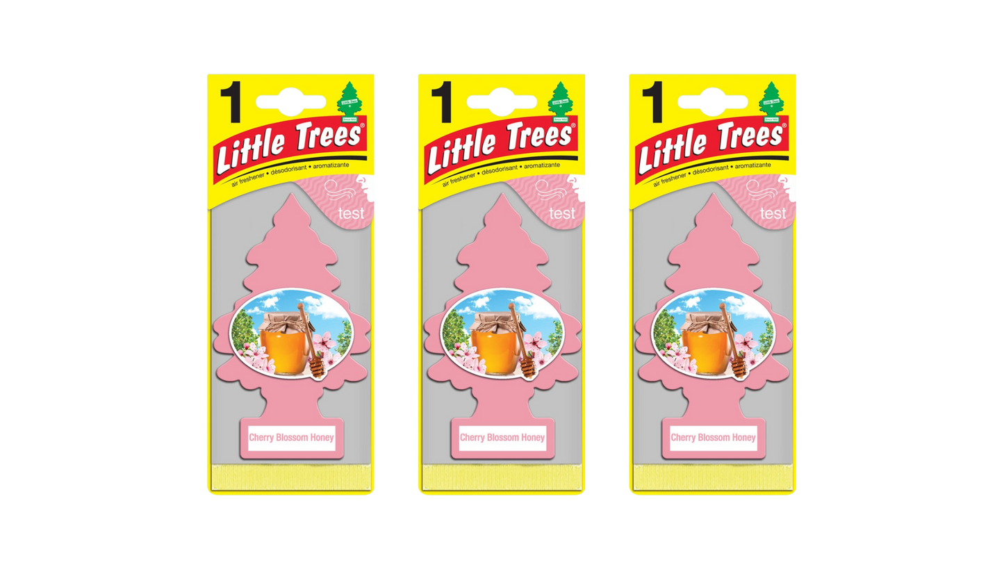 Three packages of Little Trees air fresheners on a white background