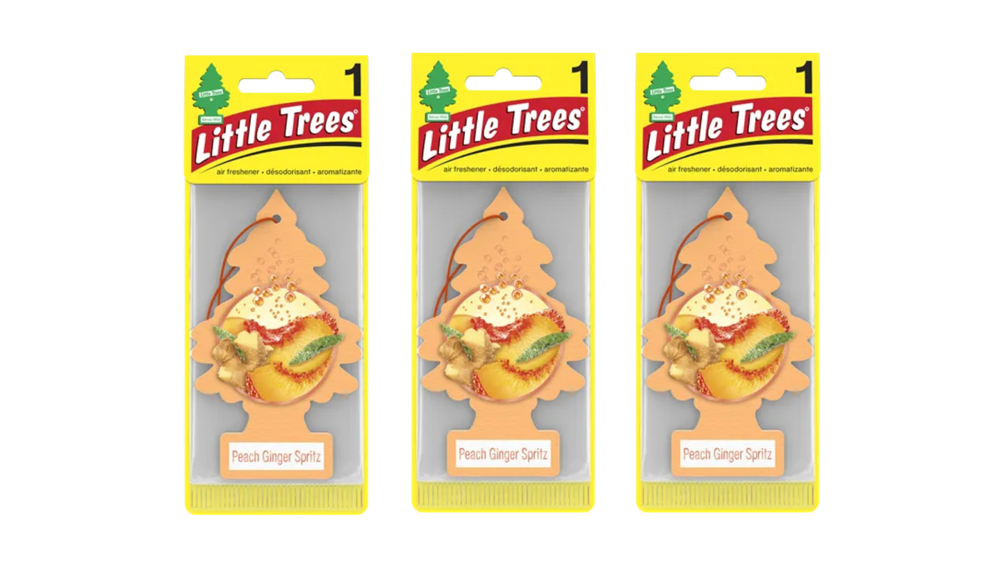 Three packages of Little Trees with peach ginger spritz scent on a white background