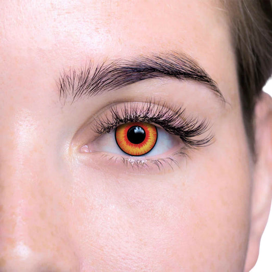 Close-up of a person's eye with multicolored contact lenses on a white background