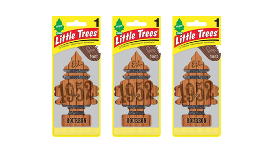 Three packages of Little Trees 1952 Bourbon air fresheners on a white background