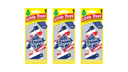 Three packages of Little Trees Fresh Shave air freshener on a white background