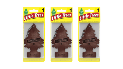 Three packages of Little Trees air fresheners on a white background