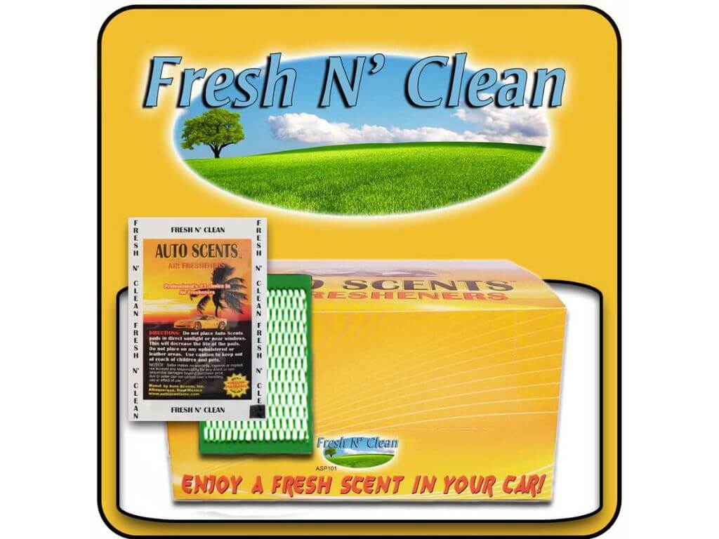 Packaging of 'Fresh N' Clean' car freshener with grass and tree graphic on yellow background