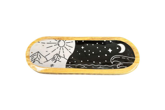 Decorative wooden incense holder with sun, moon, and mountain designs on a white background. Epic Saves