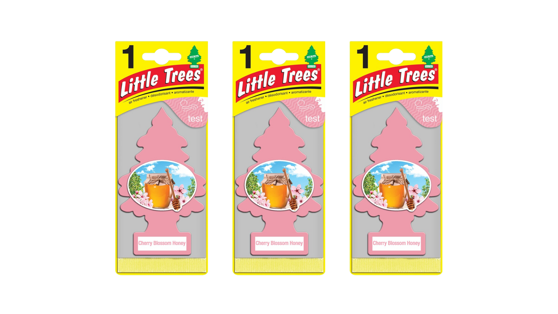 Three packages of Little Trees air fresheners on a white background