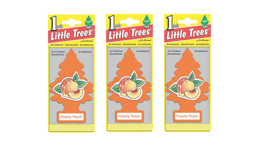 Three packages of Little Trees Dandy Peach air fresheners on a white background