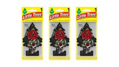 Three packages of Little Trees air fresheners with floral designs on a white background