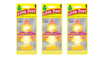 Three packages of Little Trees air freshener with sunset beach scent on a white background.