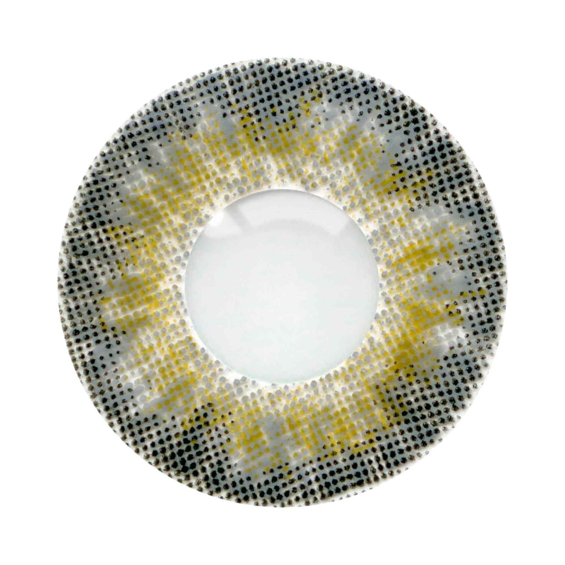 Round contact lens with yellow and black pattern on a white background