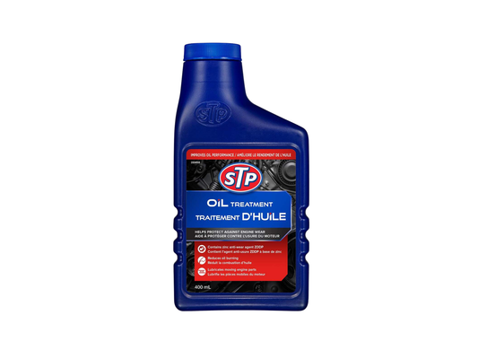 Bottle of STP oil treatment on a white background