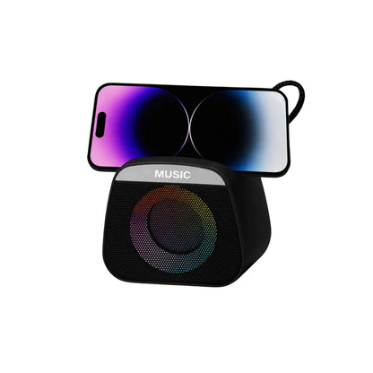 Black portable speaker with 'MUSIC' text and colorful light from phone display on a white background